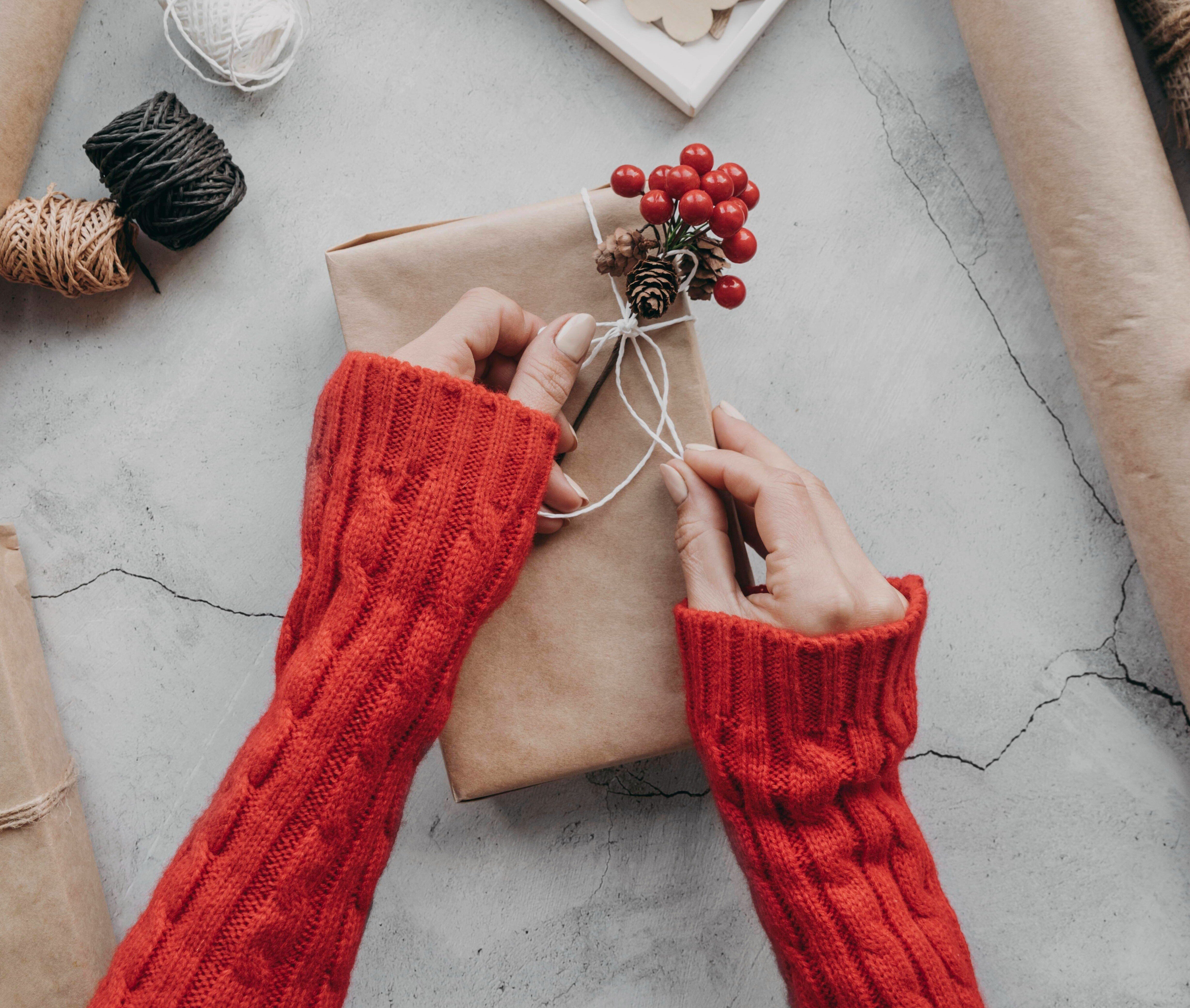 close-up-hands-wrapping-presents-1